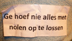 Tekst op rug van een van de deelnemers.